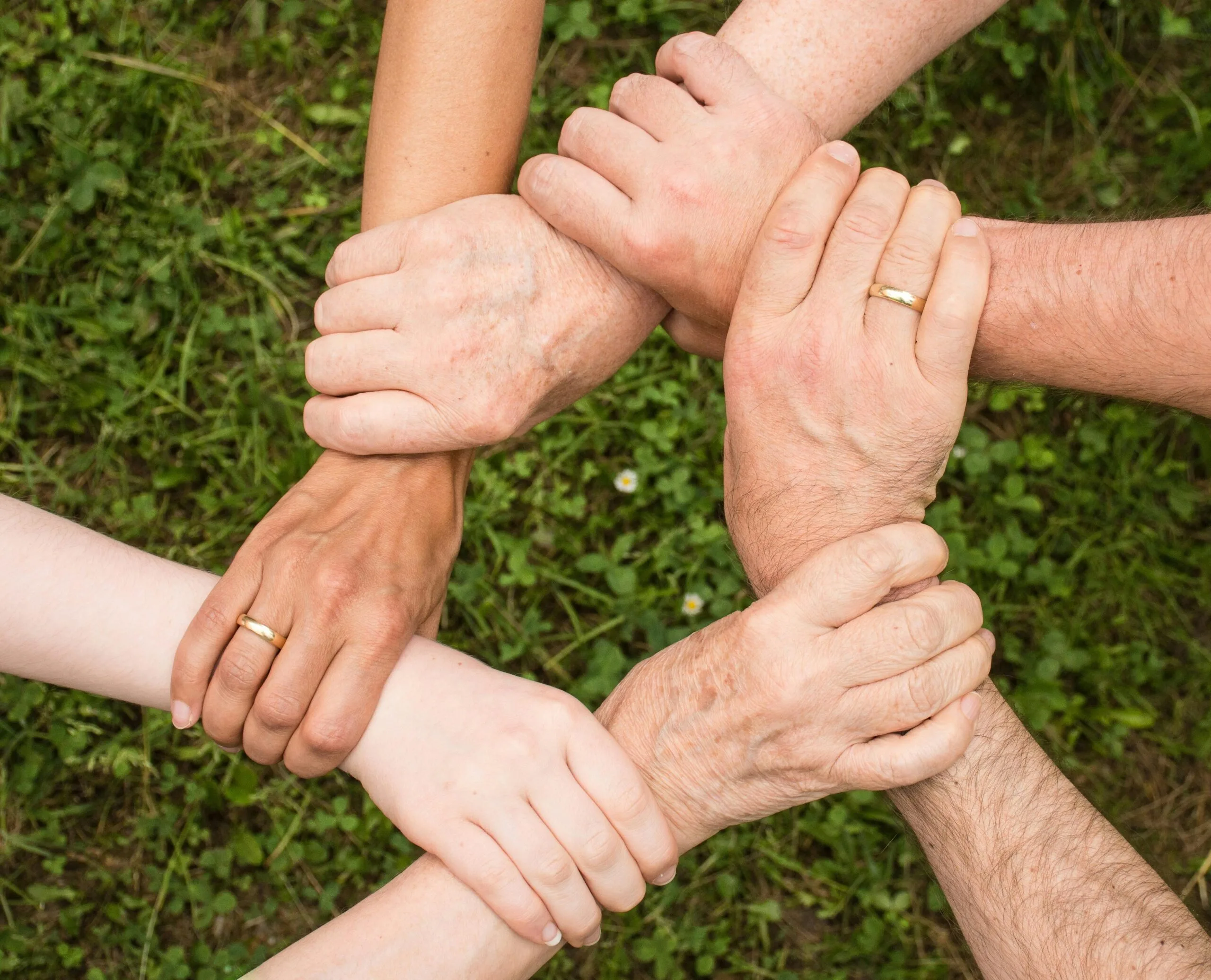 hands team interlocked